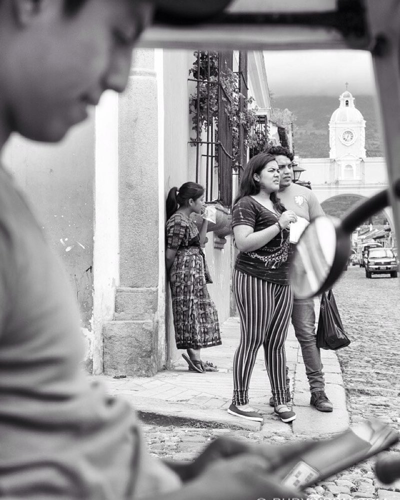 Street photography framing of daily life in Antigua Guatemala