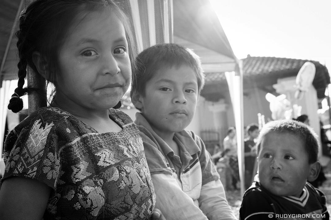 Street Photography Portraits — Maya Children’s Faces Watching The Convite Parade in San Pedro Las Huertas