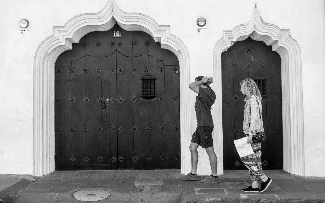 #StreetPhotographyTip — Couple framed within two baroque Moorish doorways found in Antigua Guatemala