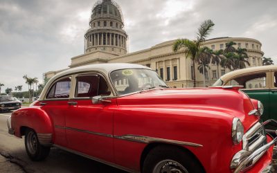 #TravelPhotographyWorkshop — Red classic car in front of the Capitolio in Havana, Cuba