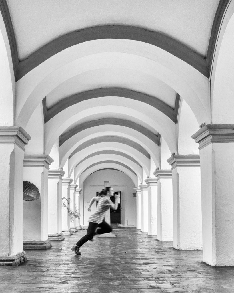 Street Photography — Framed Runner in Colonial Arches from Antigua Guatemala