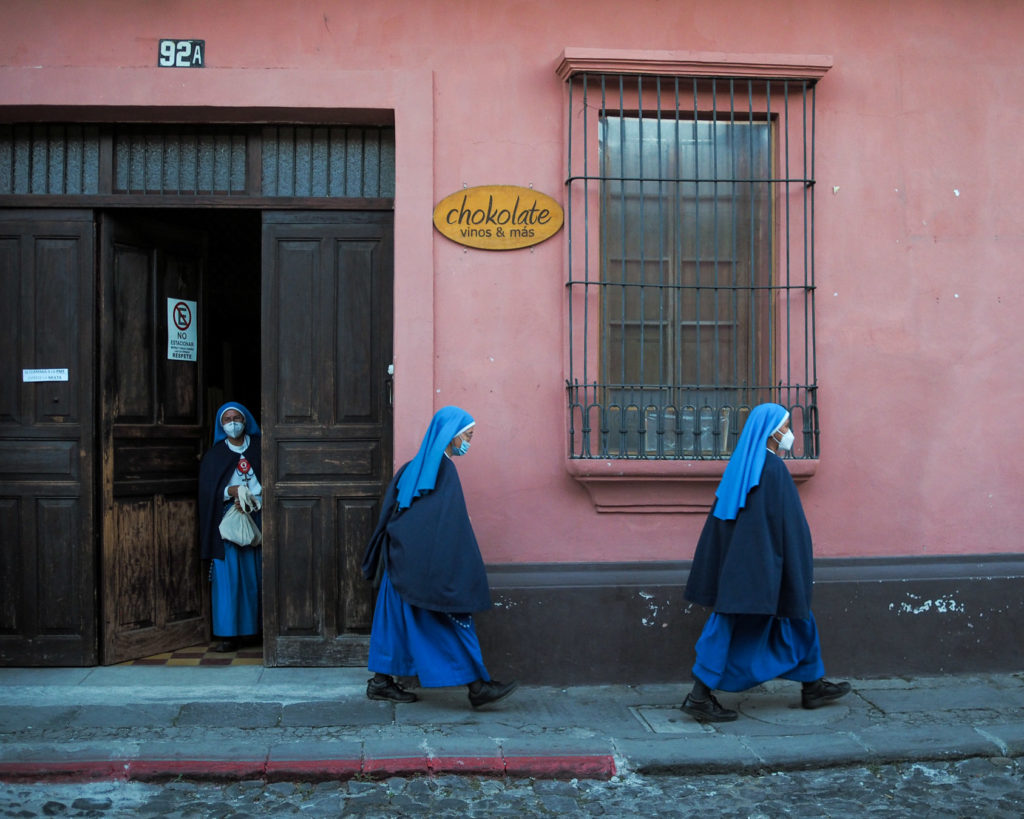 Three nuns on the streets of Antigua Guatemala by Rudy Giron